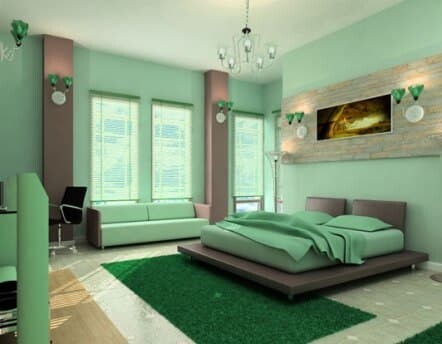 Una camera da letto color verde