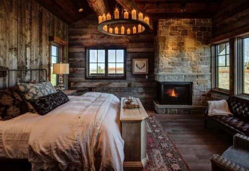 Camera da letto rustica con caminetto.