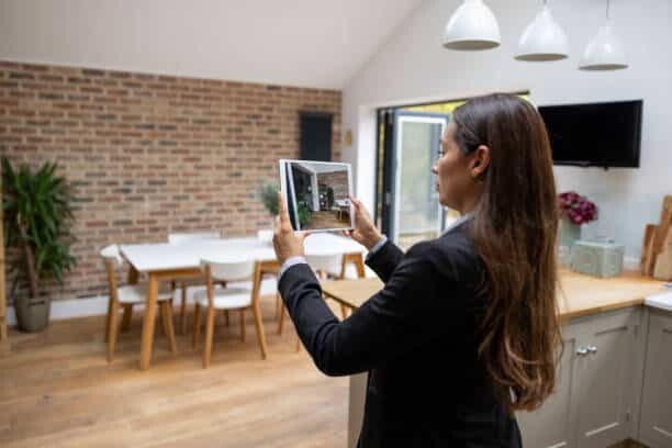 Real estate agent doing a virtual showing of a property using a tablet computer