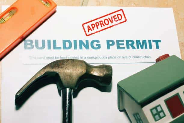 Building Permit concept with approved text on a residential home .