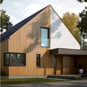 Vista frontale di una casa container sostenibile in legno e cemento, immersa in una pineta, con ampie vetrate e tetto spiovente moderno.